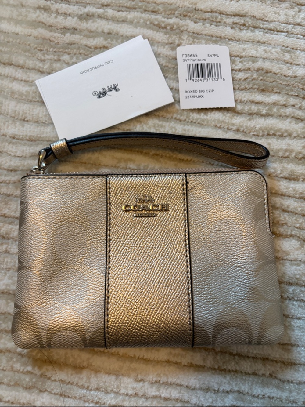 Coach Metallic Silver Wristlet with Gold-Tone Logo
